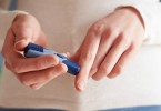 Female Diabetic Checking Blood Sugar Levels