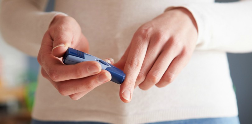 Female Diabetic Checking Blood Sugar Levels