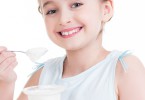 Girl eating a yogurt