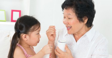 child-grandmother-eating-yogurt-1620x800