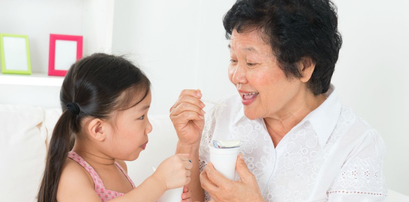 child-grandmother-eating-yogurt-1620x800