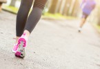 Female Runner Shoes closeup before Running at Park. Shallow depth of Field, focus on rear shoe