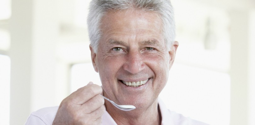 Middle Aged Man Eating Yogurt