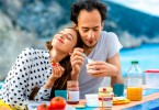 young couple eating yogurt