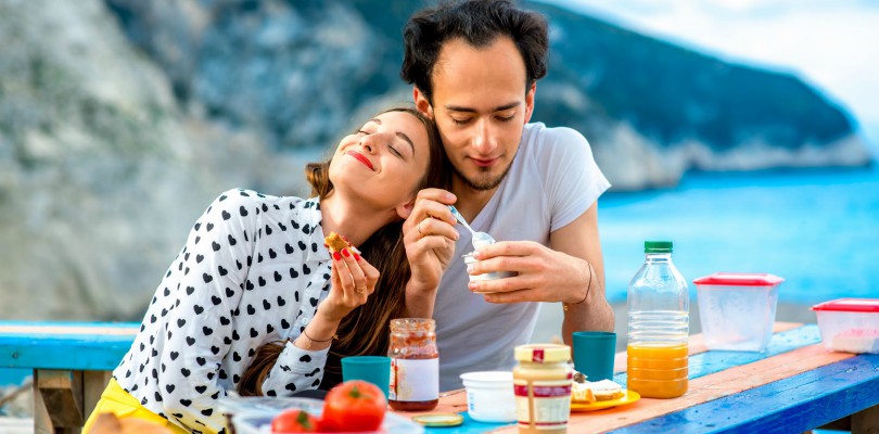 young couple eating yogurt