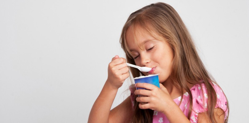 Adorable-Little-Girl-Eating-Yogurt